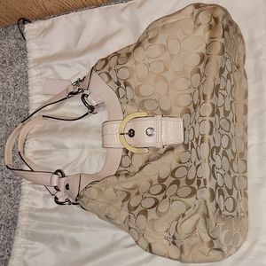 Pale pink accented Coach handbag